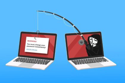 Image showing two laptops; one with a masked man phishing for information from the second laptop. Image used for blog on identifying and avoiding phishing emails